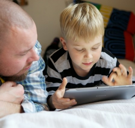 Father and son with a tablet