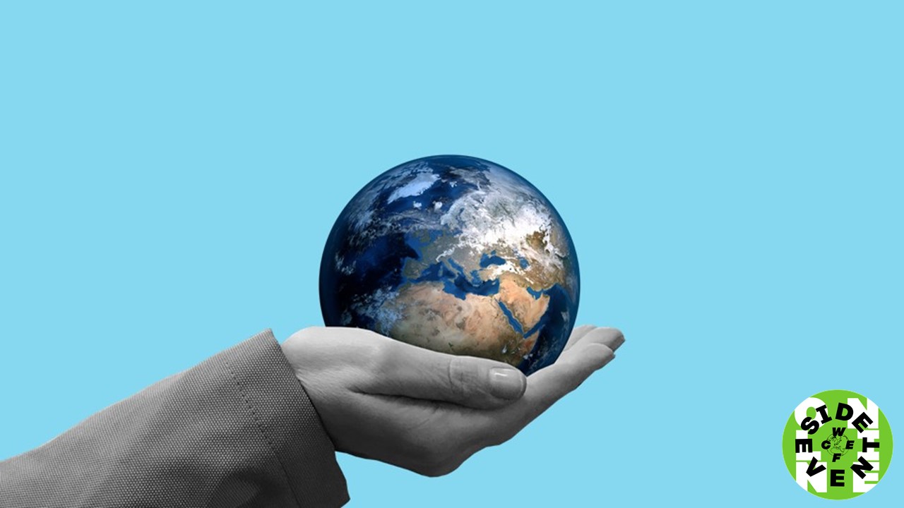 A hand holding the globe.